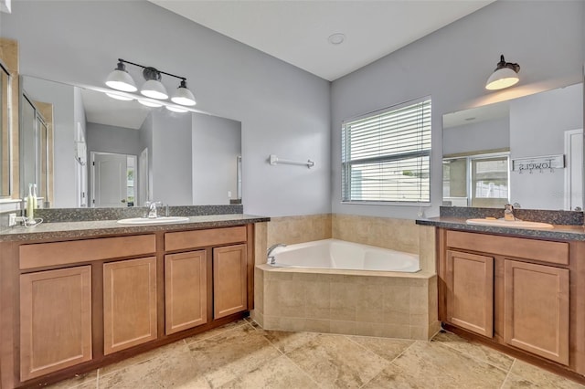 11616 Thacker Dr, Clermont, FL 34711 - full bathroom with a shower stall, two vanities, and a bath