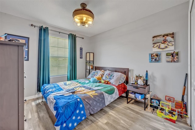 11616 Thacker Dr, Clermont, FL 34711 - bedroom featuring wood finished floors and baseboards