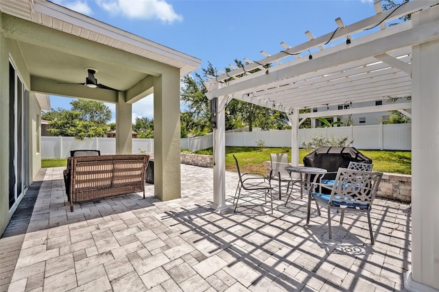11616 Thacker Dr, Clermont, FL 34711 - fenced backyard featuring a pergola, a ceiling fan, a patio, and an outdoor living space