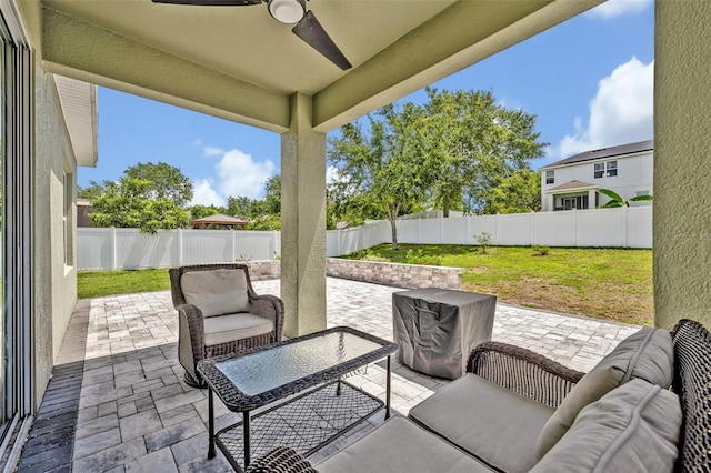 11616 Thacker Dr, Clermont, FL 34711 - fenced backyard with a patio, a ceiling fan, and outdoor lounge area
