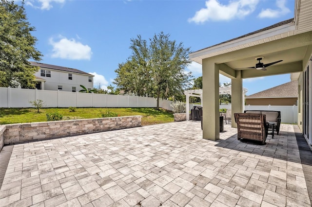 11616 Thacker Dr, Clermont, FL 34711 - fenced backyard featuring ceiling fan, a patio area, and outdoor dining area