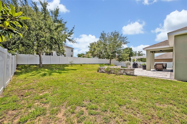 11616 Thacker Dr, Clermont, FL 34711 - fenced backyard with a patio area and a ceiling fan