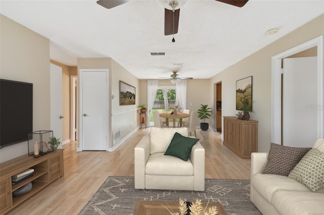 191 Ruskin St, Lake Mary, FL 32746 - living room featuring a ceiling fan and light wood-style floors