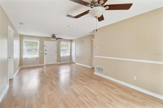 191 Ruskin St, Lake Mary, FL 32746 - empty room with ceiling fan, light wood-style floors, and a smoke detector