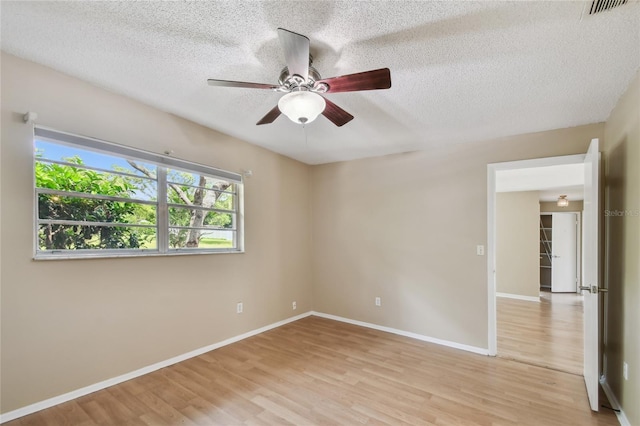 191 Ruskin St, Lake Mary, FL 32746 - unfurnished room with light wood-style floors, a textured ceiling, and ceiling fan