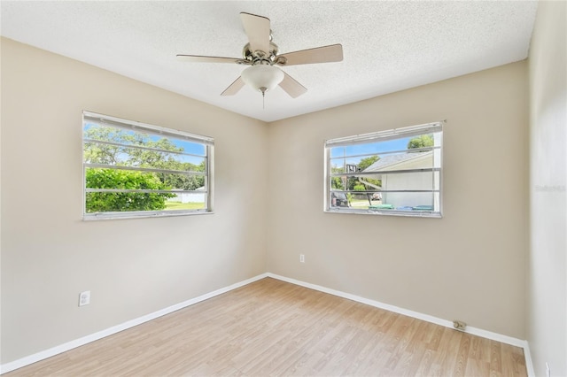 191 Ruskin St, Lake Mary, FL 32746 - empty room with wood finished floors, ceiling fan, and a textured ceiling