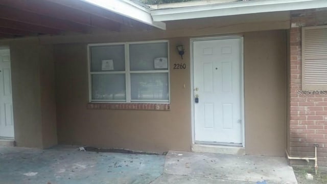 2260 Willie Mays Pkwy, Orlando, FL 32811 - doorway to property with brick siding and stucco siding