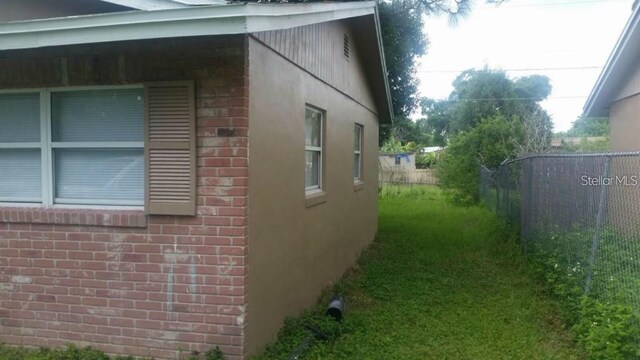 2260 Willie Mays Pkwy, Orlando, FL 32811 - view of side of home featuring brick siding