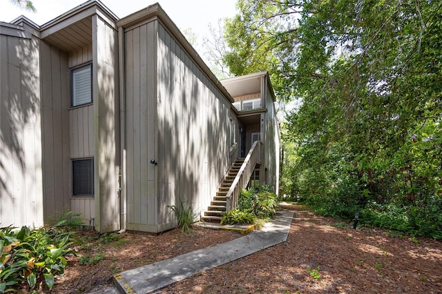 211 Crown Oaks Way Unit 205, Longwood, FL 32779 - view of home's exterior featuring stairway
