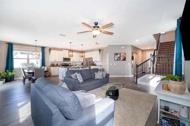 3943 Crawley Down Loop, Sanford, FL 32773 - living room with baseboards, stairway, dark wood finished floors, ceiling fan, and recessed lighting