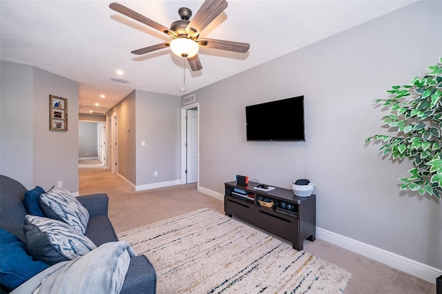 3943 Crawley Down Loop, Sanford, FL 32773 - living room featuring light colored carpet, ceiling fan, baseboards, and recessed lighting
