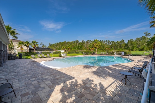 3943 Crawley Down Loop, Sanford, FL 32773 - community pool with a patio and view of wooded area