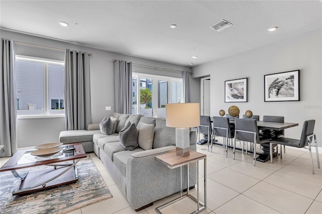 7740 Sandy Ridge Dr Unit 124, Reunion, FL 34747 - living room featuring light tile patterned flooring and recessed lighting