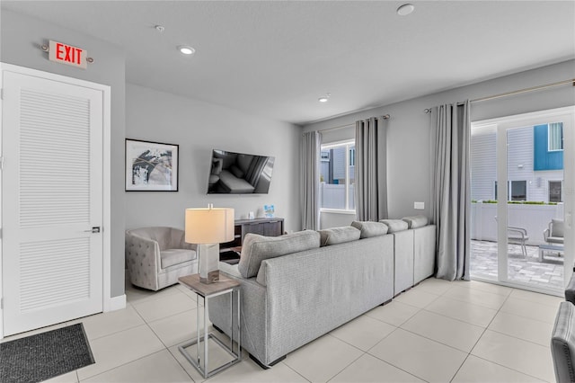 7740 Sandy Ridge Dr Unit 124, Reunion, FL 34747 - living area with recessed lighting and light tile patterned floors