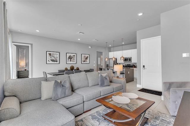 7740 Sandy Ridge Dr Unit 124, Reunion, FL 34747 - living area with light tile patterned floors and recessed lighting