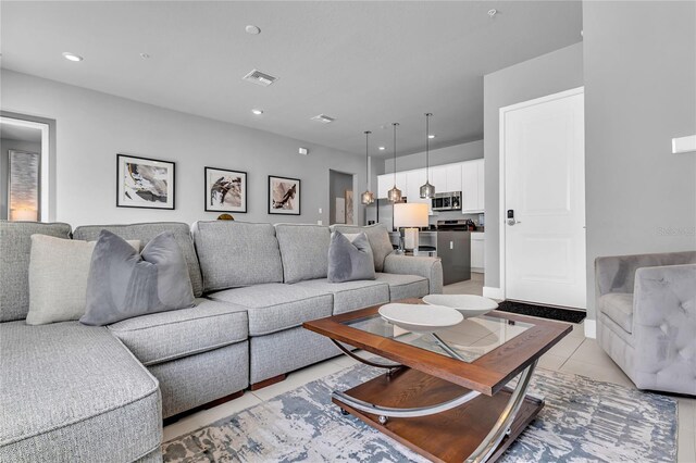 7740 Sandy Ridge Dr Unit 124, Reunion, FL 34747 - living area featuring light tile patterned floors and recessed lighting