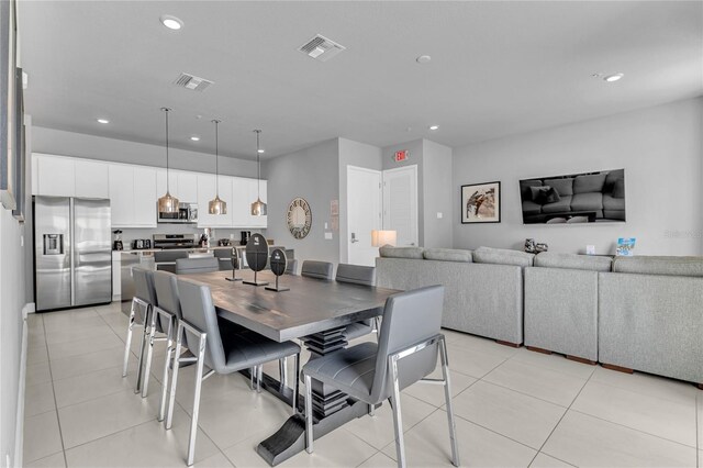7740 Sandy Ridge Dr Unit 124, Reunion, FL 34747 - dining space with recessed lighting and light tile patterned flooring