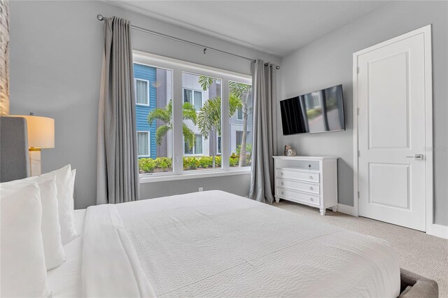 7740 Sandy Ridge Dr Unit 124, Reunion, FL 34747 - bedroom with carpet flooring and baseboards