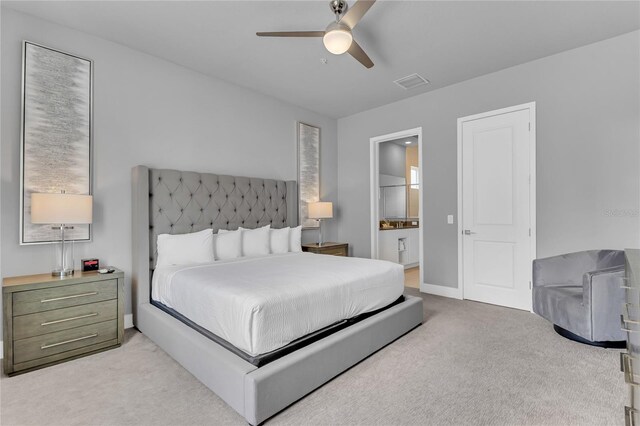 7740 Sandy Ridge Dr Unit 124, Reunion, FL 34747 - bedroom featuring light carpet, ensuite bathroom, and ceiling fan