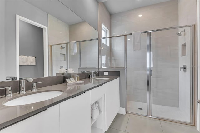 7740 Sandy Ridge Dr Unit 124, Reunion, FL 34747 - bathroom featuring double vanity, a shower stall, and tile patterned flooring