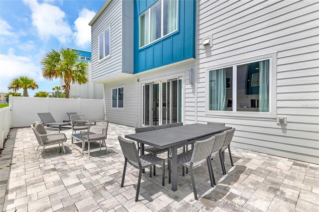 7740 Sandy Ridge Dr Unit 124, Reunion, FL 34747 - fenced backyard featuring an outdoor living space, a patio area, and outdoor dining space