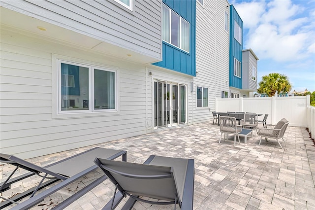 7740 Sandy Ridge Dr Unit 124, Reunion, FL 34747 - view of patio featuring outdoor dining space and an outdoor hangout area