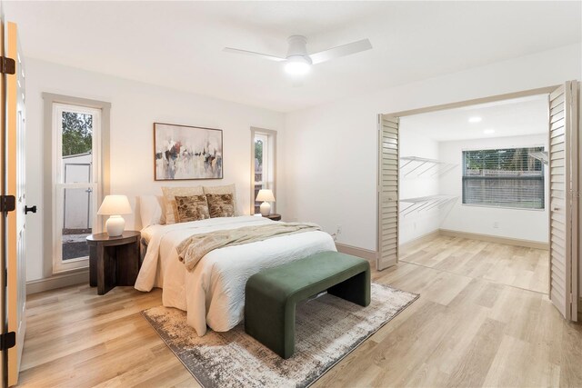 7446 Houston Ct E, Winter Park, FL 32792 - bedroom featuring light wood finished floors, baseboards, and ceiling fan