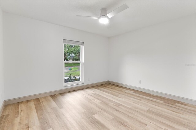 7446 Houston Ct E, Winter Park, FL 32792 - spare room featuring light wood-style floors, ceiling fan, and baseboards