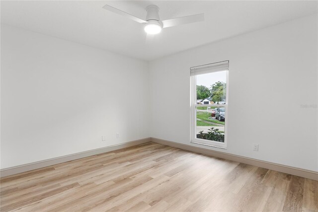 7446 Houston Ct E, Winter Park, FL 32792 - spare room featuring light wood-style flooring, baseboards, and a ceiling fan