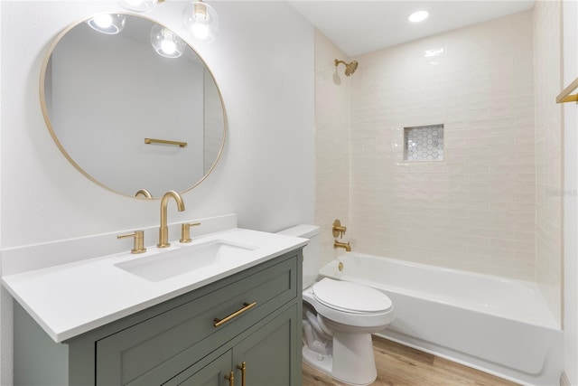 7446 Houston Ct E, Winter Park, FL 32792 - full bath featuring vanity, toilet, wood finished floors, and bathing tub / shower combination