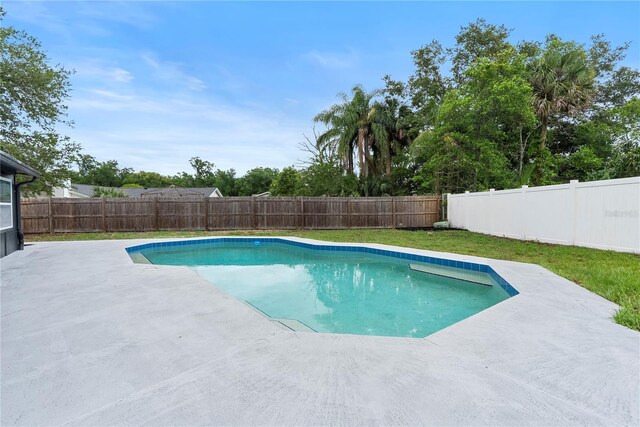 7446 Houston Ct E, Winter Park, FL 32792 - view of swimming pool with a patio and a fenced backyard