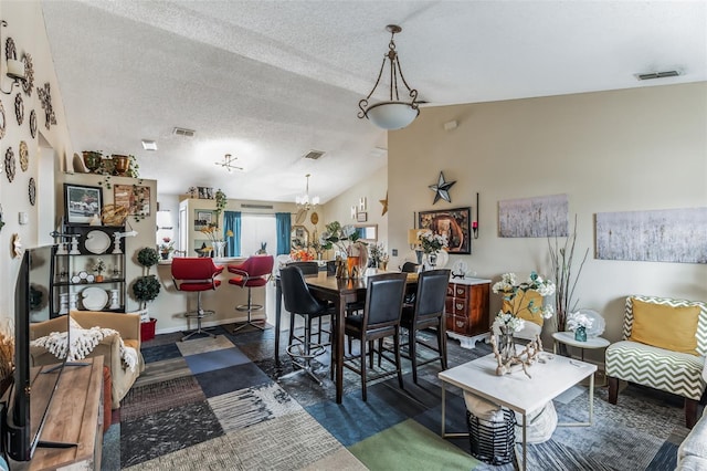 1907 Myakka Ct, Poinciana, FL 34759 - living room with a textured ceiling, lofted ceiling, and a chandelier