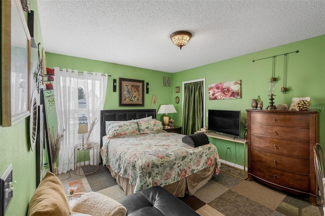 1907 Myakka Ct, Poinciana, FL 34759 - bedroom with a textured ceiling and carpet