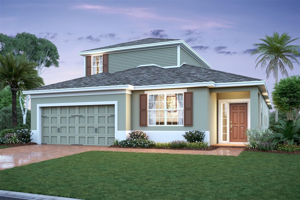 2676 Bittern Bnd, Saint Cloud, FL 34773 - view of front of property with driveway, a front yard, an attached garage, and stucco siding