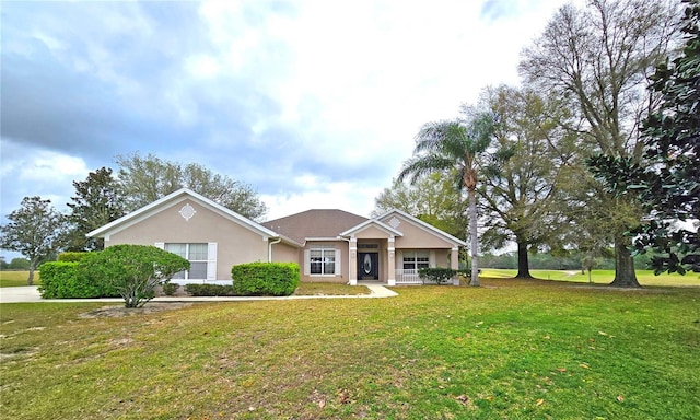 36730 Oconee Ave, Eustis, FL 32736 - ranch-style home with a front lawn and stucco siding