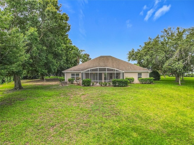 36730 Oconee Ave, Eustis, FL 32736 - rear view of property featuring a yard and glass enclosure