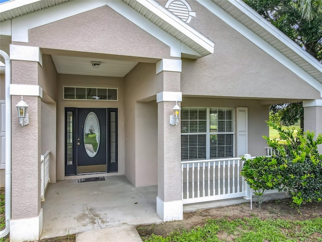 36730 Oconee Ave, Eustis, FL 32736 - property entrance featuring stucco siding and a porch