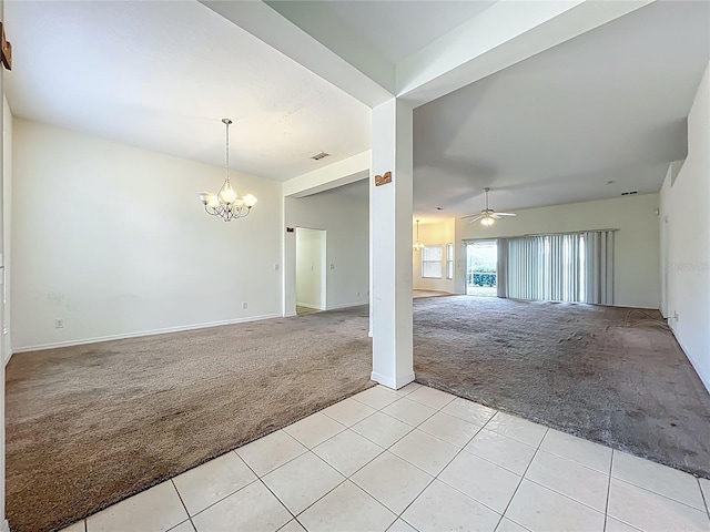 36730 Oconee Ave, Eustis, FL 32736 - unfurnished room with light colored carpet, a chandelier, light tile patterned floors, and ceiling fan