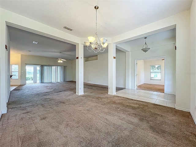 36730 Oconee Ave, Eustis, FL 32736 - unfurnished dining area featuring carpet floors, a chandelier, healthy amount of natural light, and a ceiling fan