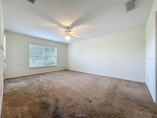 36730 Oconee Ave, Eustis, FL 32736 - spare room with a ceiling fan and carpet