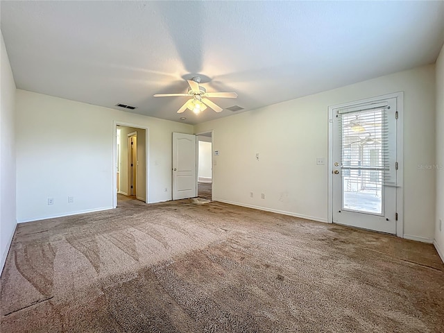 36730 Oconee Ave, Eustis, FL 32736 - unfurnished bedroom featuring carpet and a ceiling fan