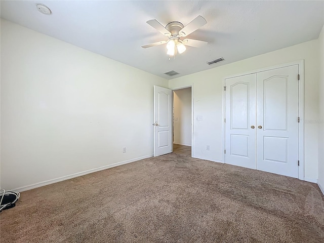 36730 Oconee Ave, Eustis, FL 32736 - unfurnished bedroom with carpet flooring, a closet, and a ceiling fan