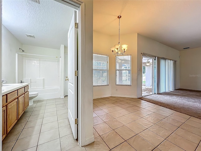 36730 Oconee Ave, Eustis, FL 32736 - full bathroom with tile patterned flooring, a chandelier, vanity, shower / bathtub combination, and a textured ceiling