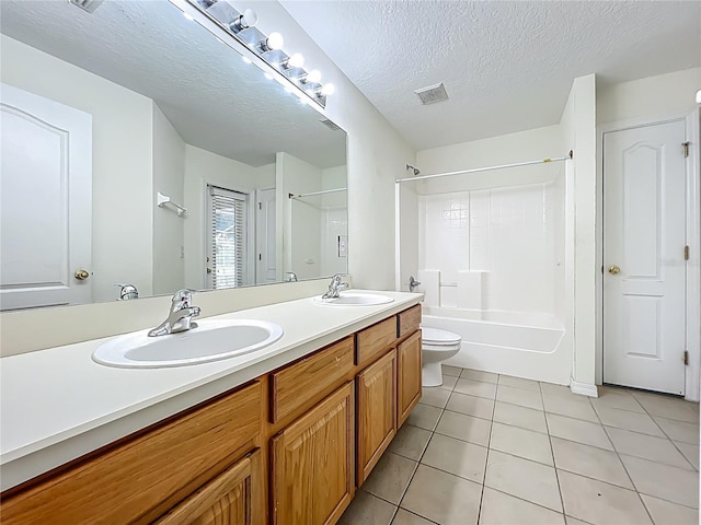 36730 Oconee Ave, Eustis, FL 32736 - full bath featuring double vanity, tile patterned flooring, shower / bathtub combination, and a textured ceiling