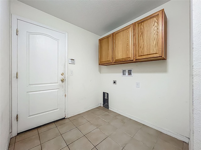 36730 Oconee Ave, Eustis, FL 32736 - laundry area with hookup for an electric dryer, hookup for a washing machine, cabinet space, and light tile patterned floors
