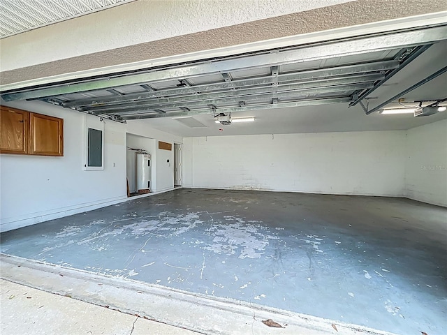 36730 Oconee Ave, Eustis, FL 32736 - garage featuring a garage door opener, water heater, and electric panel