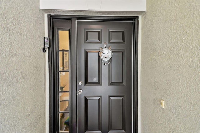 2409 Martins Run, Tavares, FL 32778 - doorway to property with stucco siding