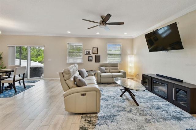 2409 Martins Run, Tavares, FL 32778 - living area featuring light wood finished floors, ceiling fan, ornamental molding, and recessed lighting