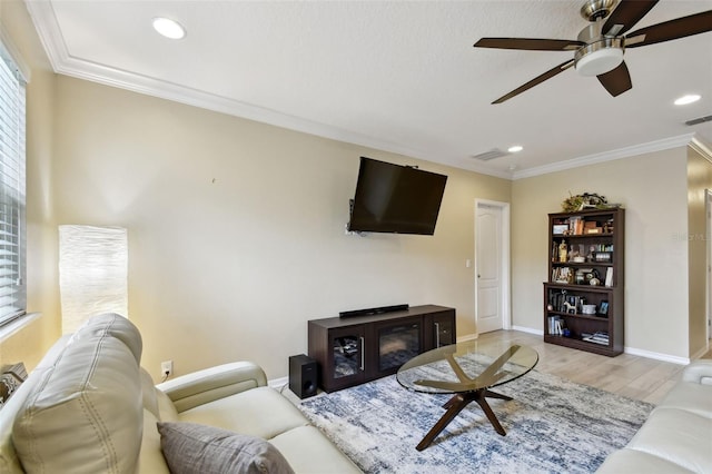 2409 Martins Run, Tavares, FL 32778 - living area with ceiling fan, light wood-style flooring, recessed lighting, and crown molding