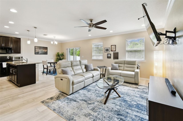 2409 Martins Run, Tavares, FL 32778 - living room with ornamental molding, ceiling fan, light wood-style floors, and recessed lighting